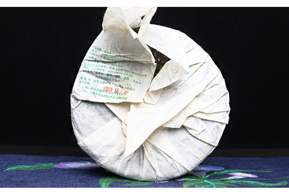 Yin Zhengong Bing 2007 Nanqiao Menghai Qiao Mu Sheng Tai Cha Puer Raw Tea 250g -