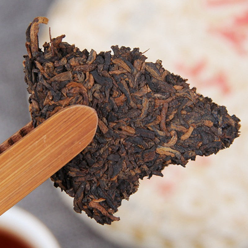 100g Ripe Pu-erh Tea Golden Bud Mini Compressed Tea Cake Yunnan Seven Sons