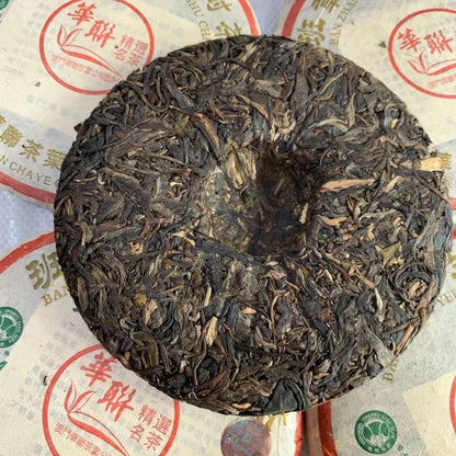 2005 HUA LIAN BAN ZHANG YEI SHENG GU SHU CHA 357g Yunnan Wild Pu'er Tea Cake