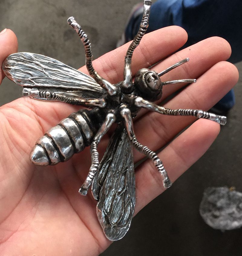 Hand sculpture of the Miao silver statue, realistic dragonfly