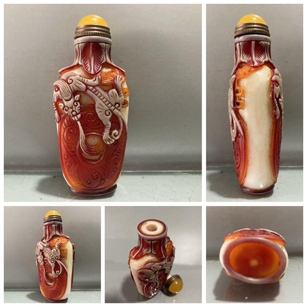 Fine red chinese snuff bottles peking glass overlay carved antique dragon statue
