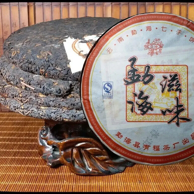 Yunnan Aromatisierter Pu'er Kuchentee Qizi Kuchentee Menghai Reifer Tee 357g