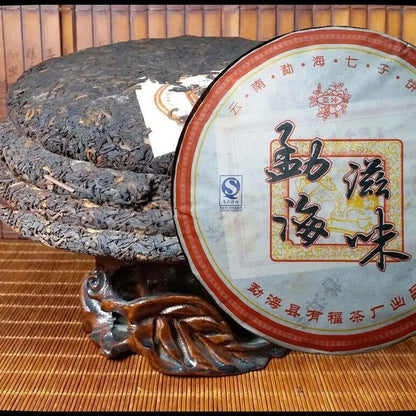 Yunnan Aromatisierter Pu'er Kuchentee Qizi Kuchentee Menghai Reifer Tee 357g
