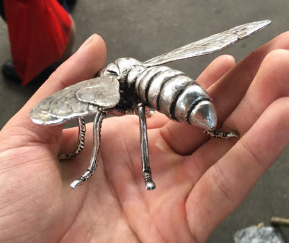 Hand sculpture of the Miao silver statue, realistic dragonfly