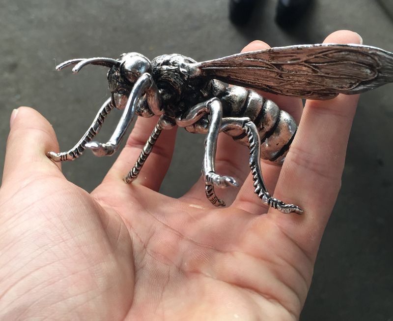 Hand sculpture of the Miao silver statue, realistic dragonfly