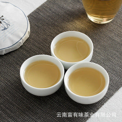 100g Pu'er Tee Island Honig Reim Kleiner Kuchen Großer Baum Pu'er Rohkuchen