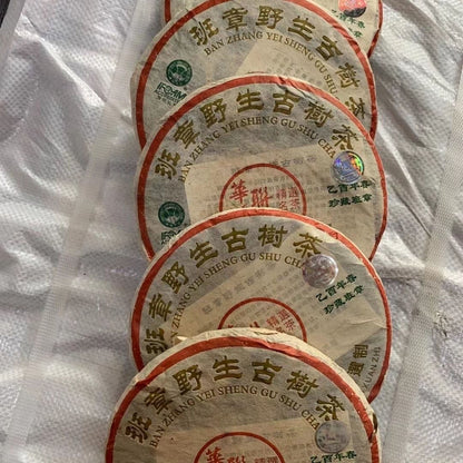 2005 HUA LIAN BAN ZHANG YEI SHENG GU SHU CHA 357g Yunnan Wild Pu'er Tea Cake