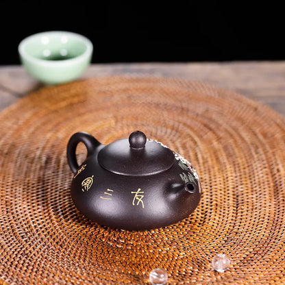 tea pot with ball shaped infuser holes handmade floral relief Chinese character marked pot original ore real yixing zisha clay