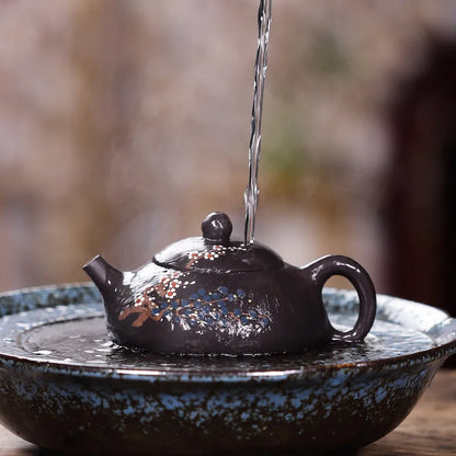 tea pot with ball shaped infuser holes handmade floral relief Chinese character marked pot original ore real yixing zisha clay
