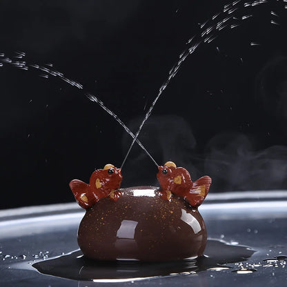 water squirt tea pet yixing zisha purple clay tea play golden fish playing on the stone house decoration handmade ornament China